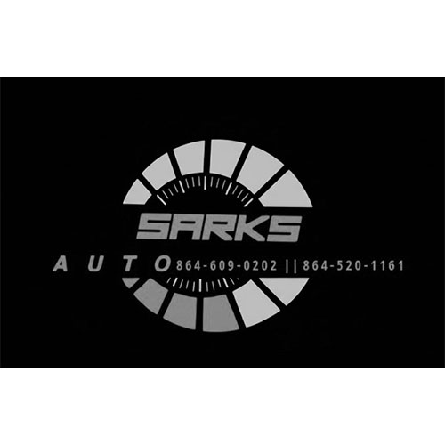 Logo with "Sarks Auto" and two phone numbers, accented by a circular, segmented speedometer graphic.
