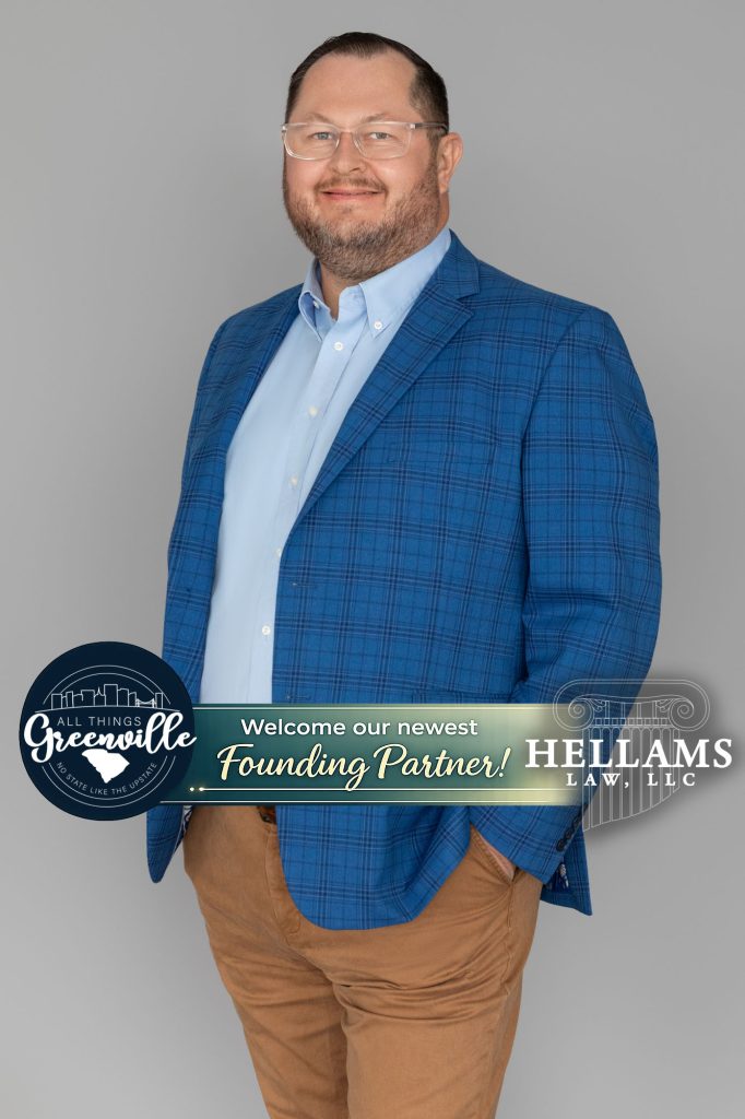 Smiling man in blue plaid blazer and tan pants stands with hands in pockets, welcome banner across image.