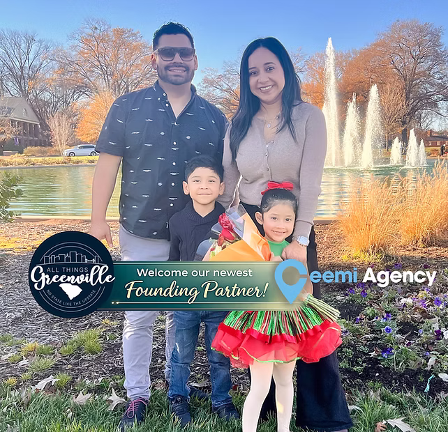 A smiling family of four poses by a pond and fountain, with partnership logos overlaid at the bottom.