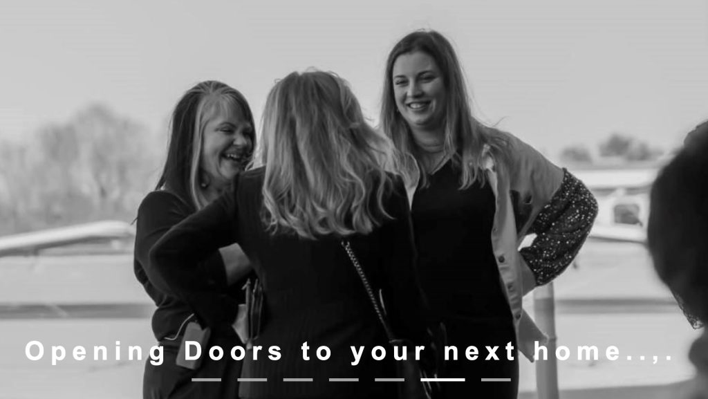 Three women standing together, smiling and talking, with the text "Opening Doors to your next home..." at the bottom.