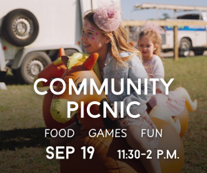 Two girls ride an inflatable horse at a community picnic; event details are overlaid in white text.