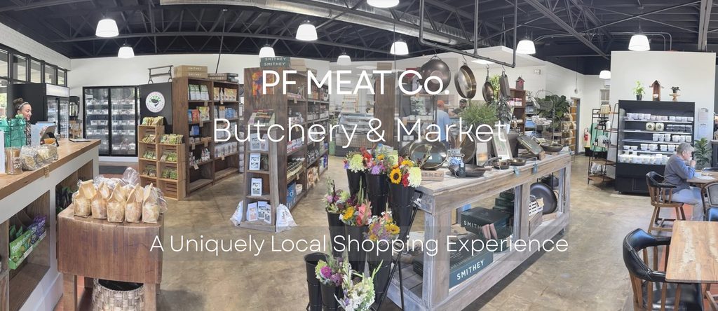 Panoramic view of PF MEAT Co. butchery and market with shelves, counters, flowers, and products displayed.
